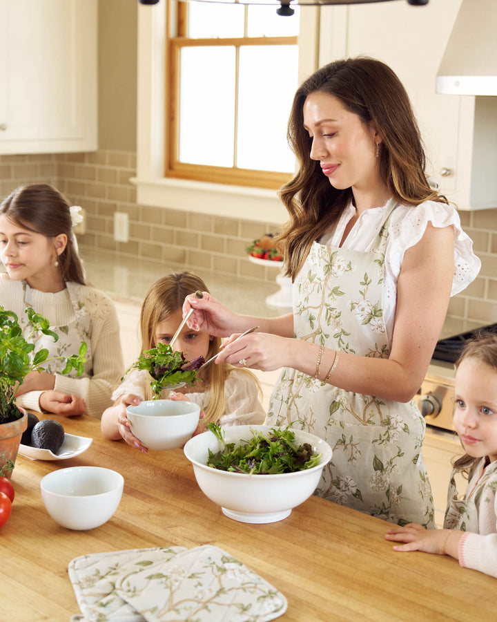 Floral cotton apron with adjustable ties and hand-drawn camellia print, ideal for home cooks and bakers. Pair with matching little kids apron for a perfect mommy and mini look 