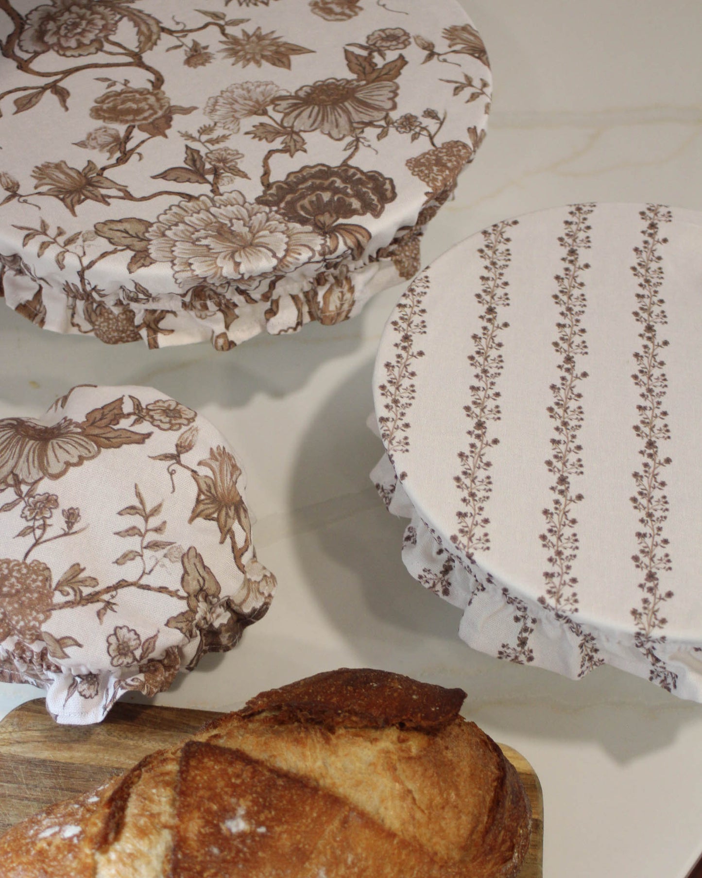 Decorative and functional bowl covers with ruffle trim and floral pattern 