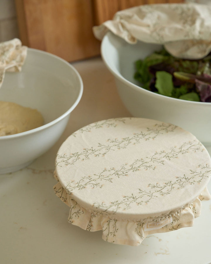 Reusable Meadow bowl covers made from breathable premium cotton in a hand-drawn floral stripe, perfect for proofing sourdough, covering bread dough, short-term food storage, fall cooking, Thanksgiving hosting, Christmas baking, spring brunches, summer entertaining, and eco-friendly kitchens.