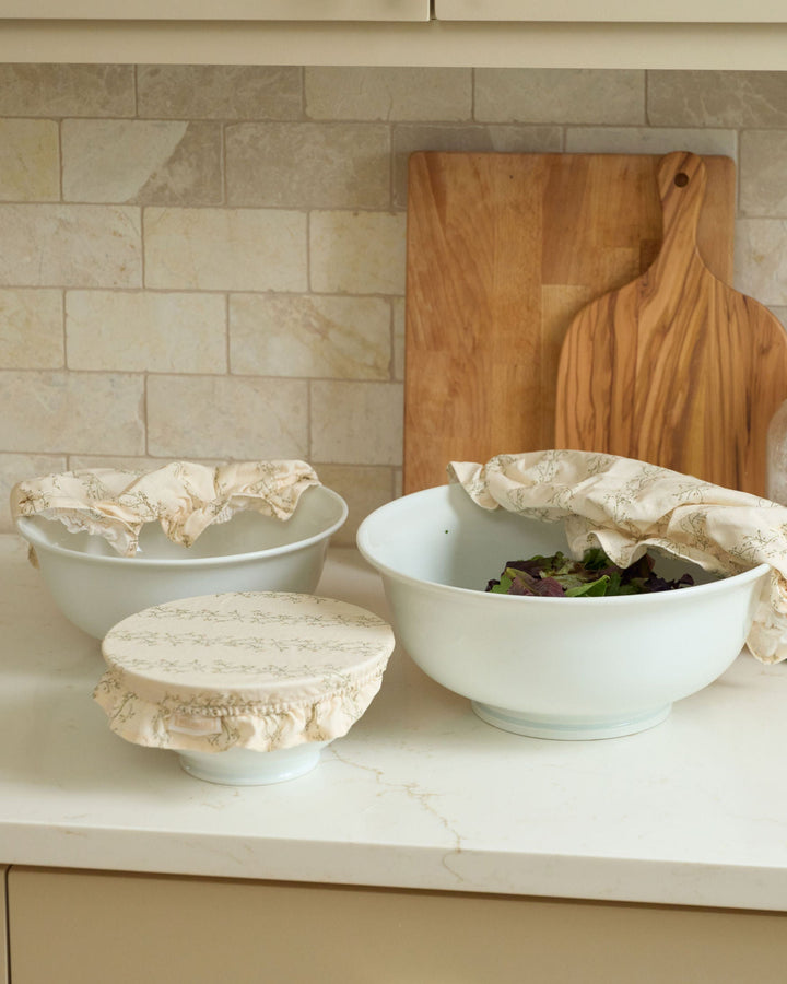 Meadow reusable cotton bowl cover set with three elasticized sizes, breathable fabric, and ruffle trim for sourdough proofing, bread baking, food storage, serving bowls, everyday cooking, spring baking, summer hosting, Thanksgiving preparation, Christmas kitchens, and sustainable plastic-free use.