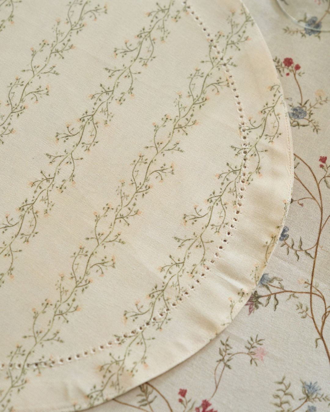 Neutral cream striped placemats featuring a green and yellow floral print for spring celebrations, autumn entertaining, and Thanksgiving dinner.