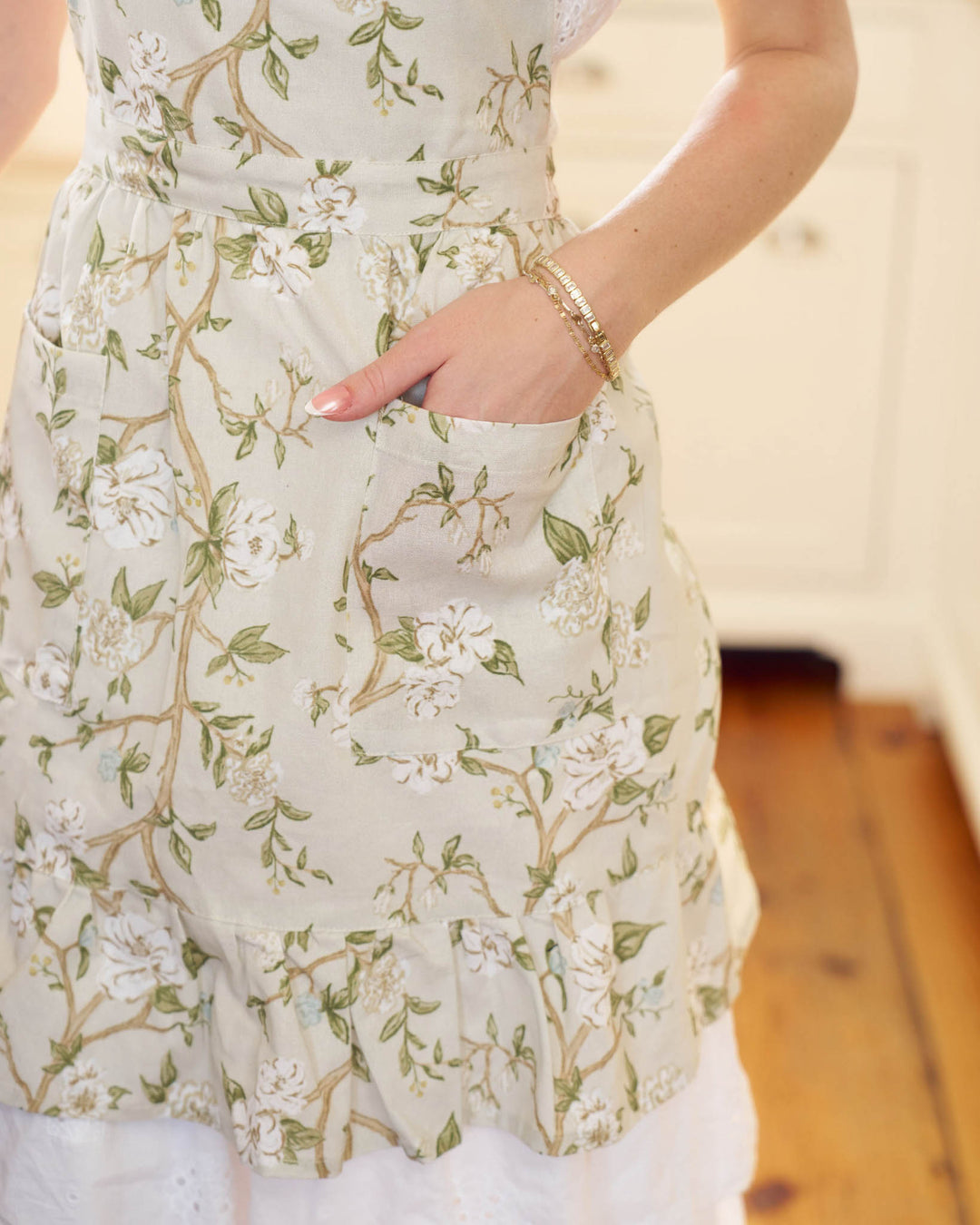 Heirloom-inspired cotton apron with hand-drawn watercolor florals, perfect for Mother’s Day.