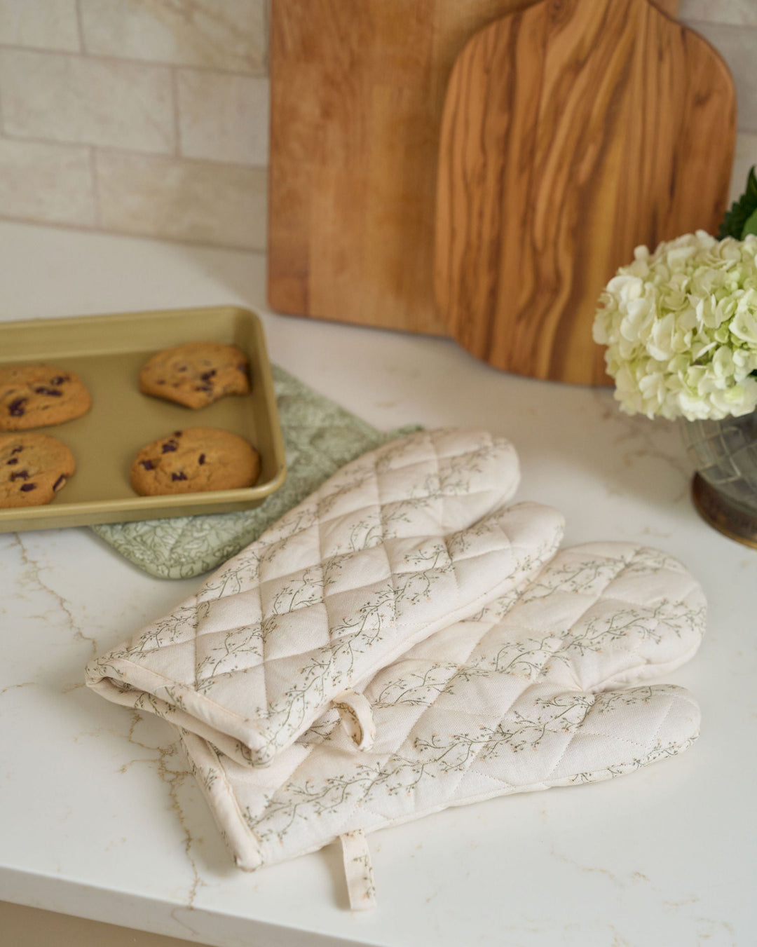 Meadow cream floral stripe cotton oven mitt set with quilted construction and heat-resistant lining, styled for everyday cooking, spring baking, summer hosting, fall recipes, Thanksgiving meal preparation, Christmas baking, holiday kitchens, hostess gifts, and year-round use.