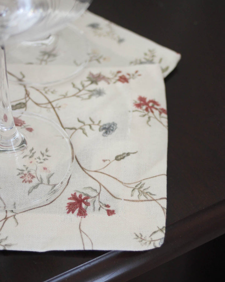Printed cotton cocktail napkins in an original botanical design, ideal for dinner parties, happy hour, and seasonal gatherings.