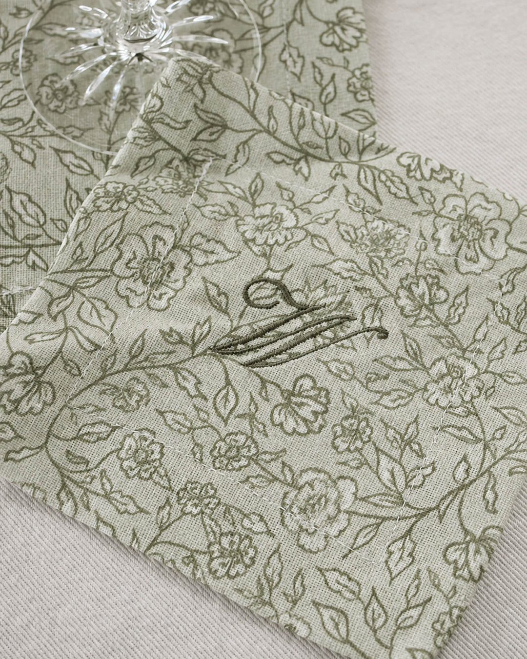 Floral cotton cocktail napkins that double as drink coasters, perfect for hostess gifts, housewarmings, and dinner parties.