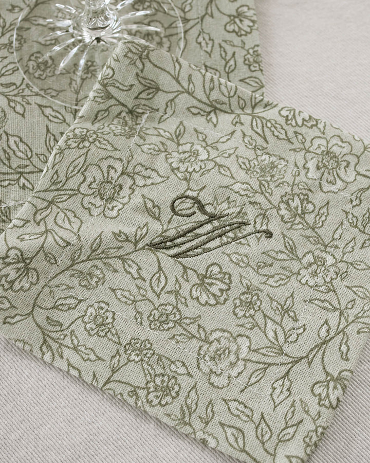 Floral cotton cocktail napkins that double as drink coasters, perfect for hostess gifts, housewarmings, and dinner parties.