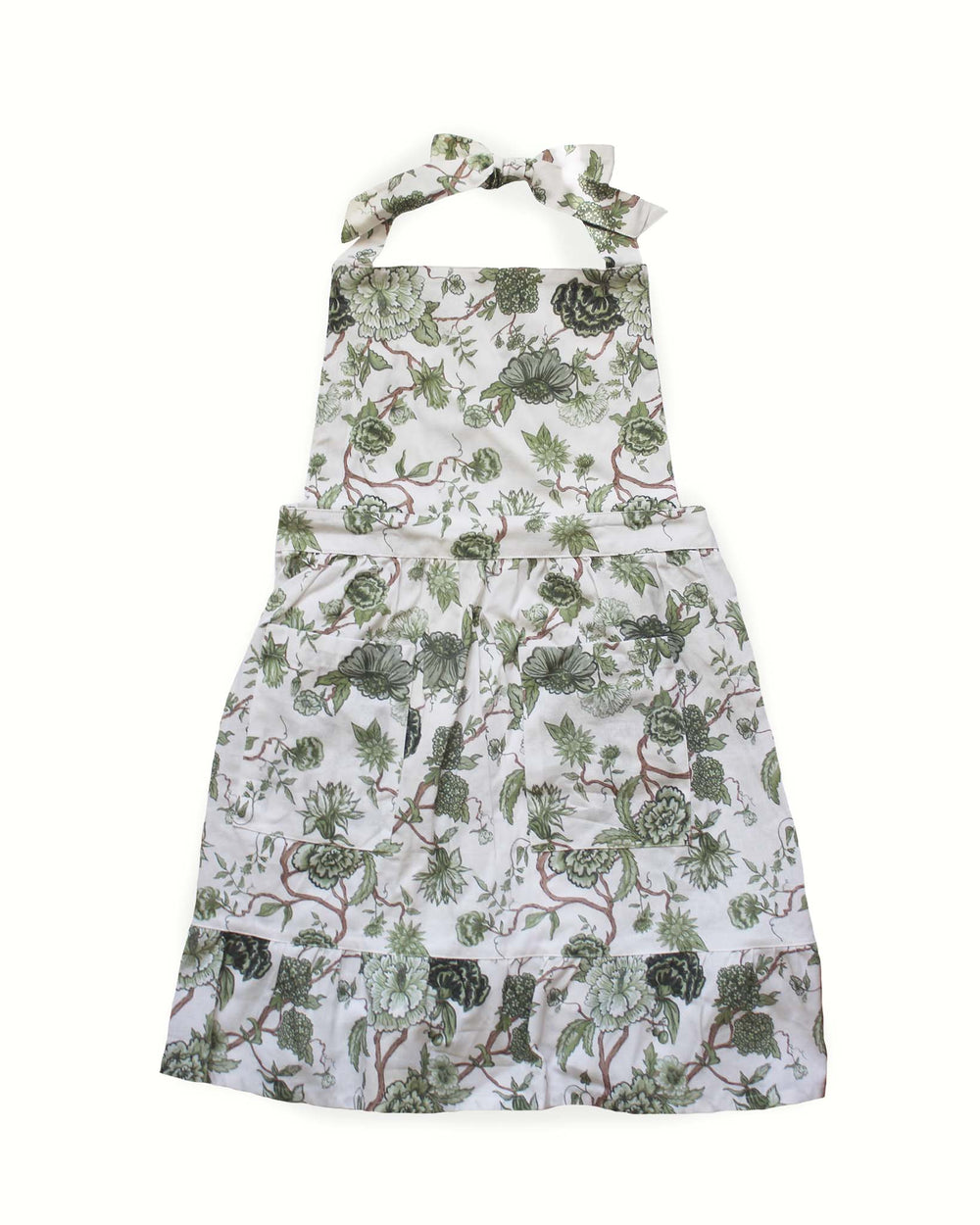 Hand-drawn floral green cotton apron with two front pockets, ruffle hem and adjustable ties, designed for home cooks, bakers, and kitchen hosting. Made with 100% cotton. 