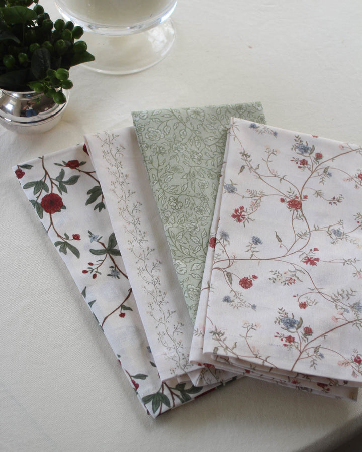 Decorative tea towel in a classic floral pattern, perfect for hanging on an oven door, styling a kitchen, or giving as a hostess gift.