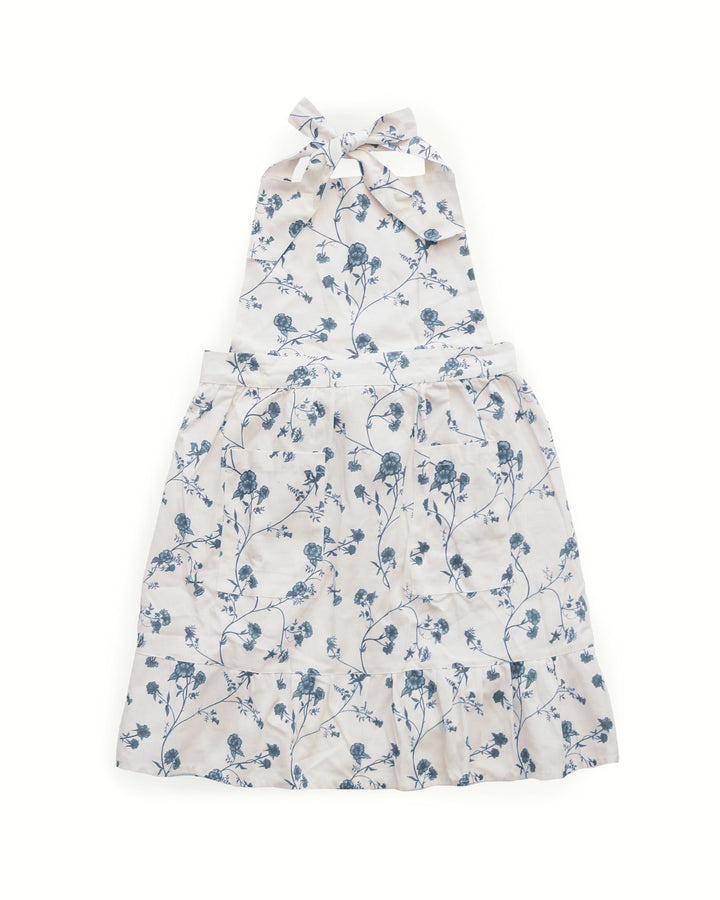 Blue and white Garden Vine apron in 100% cotton, styled for sourdough baking, everyday cooking, and relaxed summer hosting.