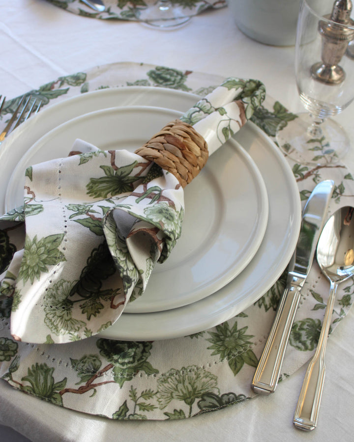 Florence round cotton placemats with green floral print, designed for coastal and Southern-inspired table settings.