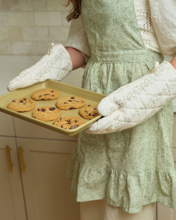 Neutral cream, moss green, and pale yellow floral oven mitts in premium quilted cotton, designed for daily cooking, weekend baking, Easter brunch, summer entertaining, autumn meals, Thanksgiving dinner, Christmas hosting, kitchen décor, and thoughtful gifts.