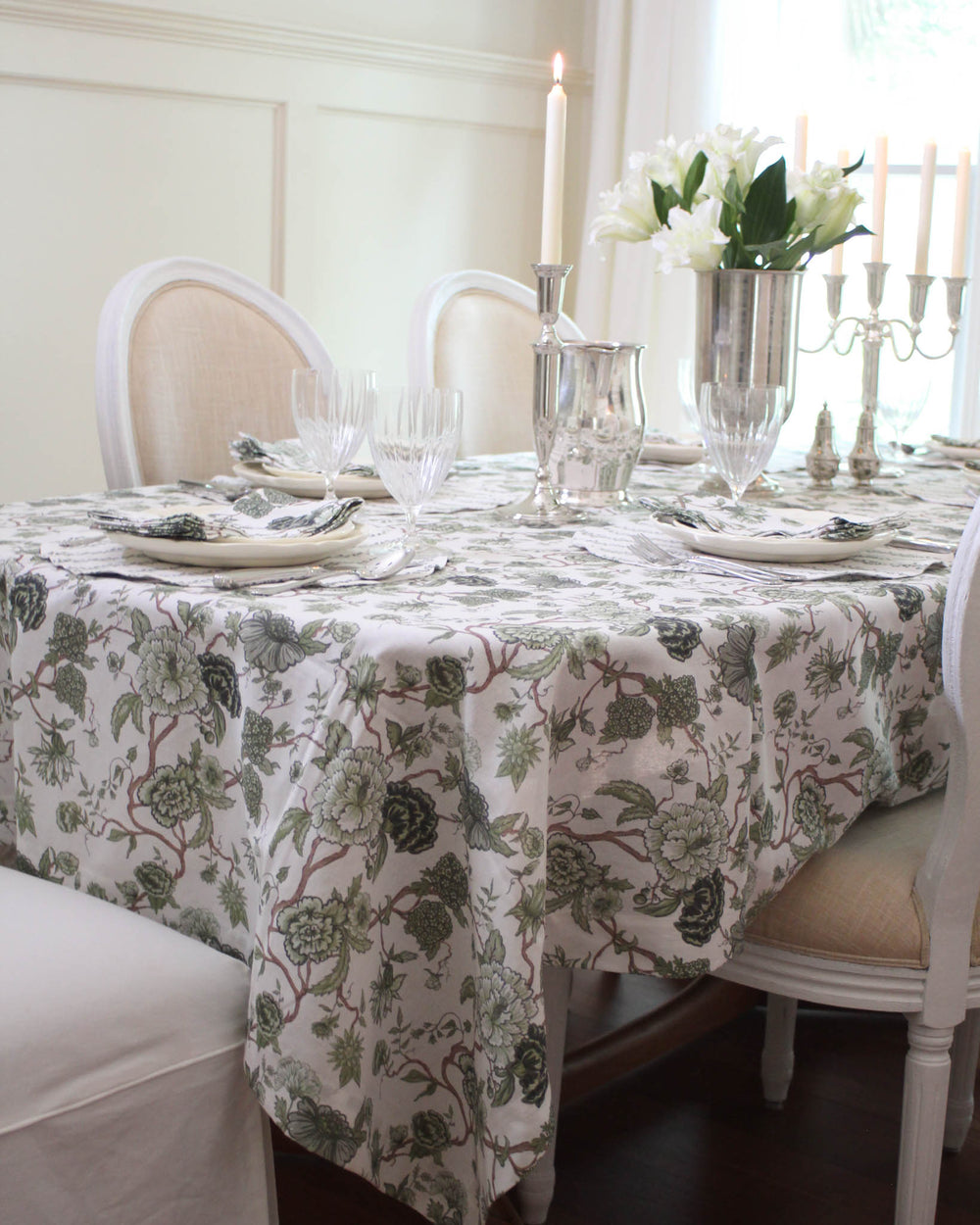 Hand-drawn Florence tablecloth in green floral print, cotton table linen perfect for summer hosting and relaxed gatherings.