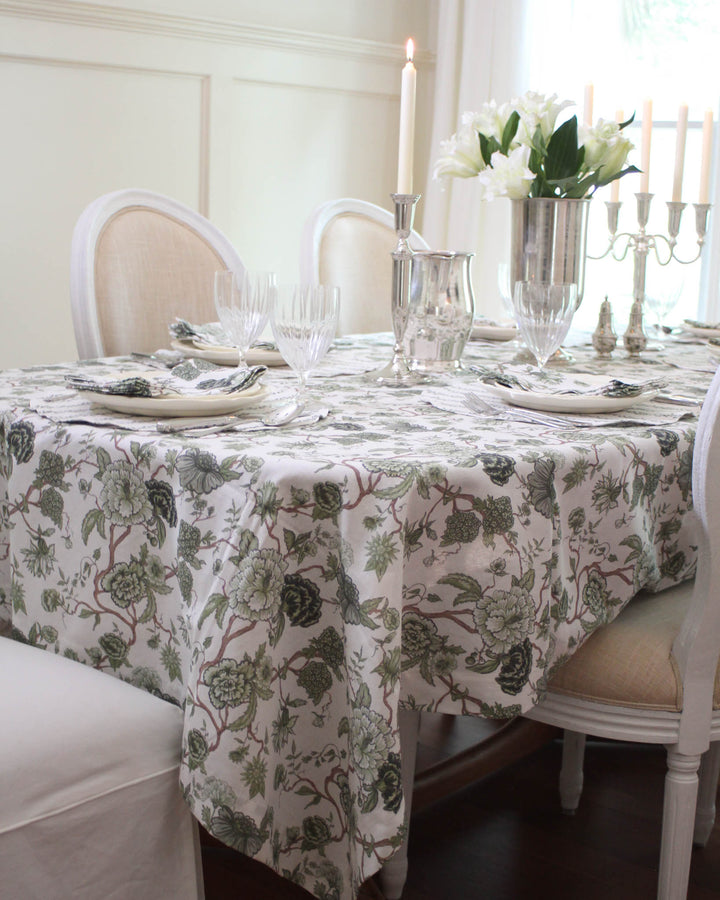 Hand-drawn Florence tablecloth in green floral print, cotton table linen perfect for summer hosting and relaxed gatherings.
