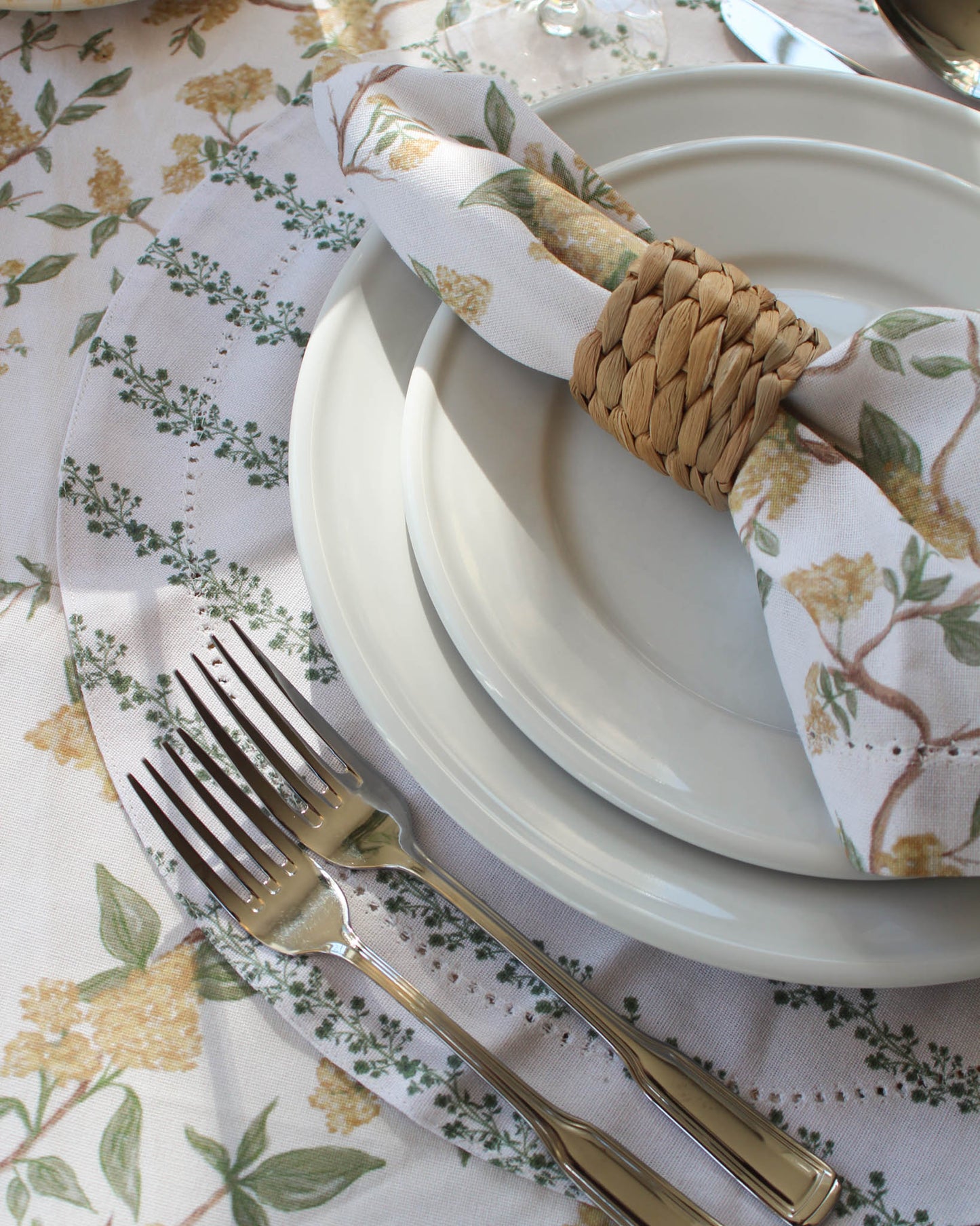 Set of Begonia Stripe round placemats in organic cotton with hand-drawn floral stripe and hemstitch detailing. Perfect thanksgiving and Christmas dining 