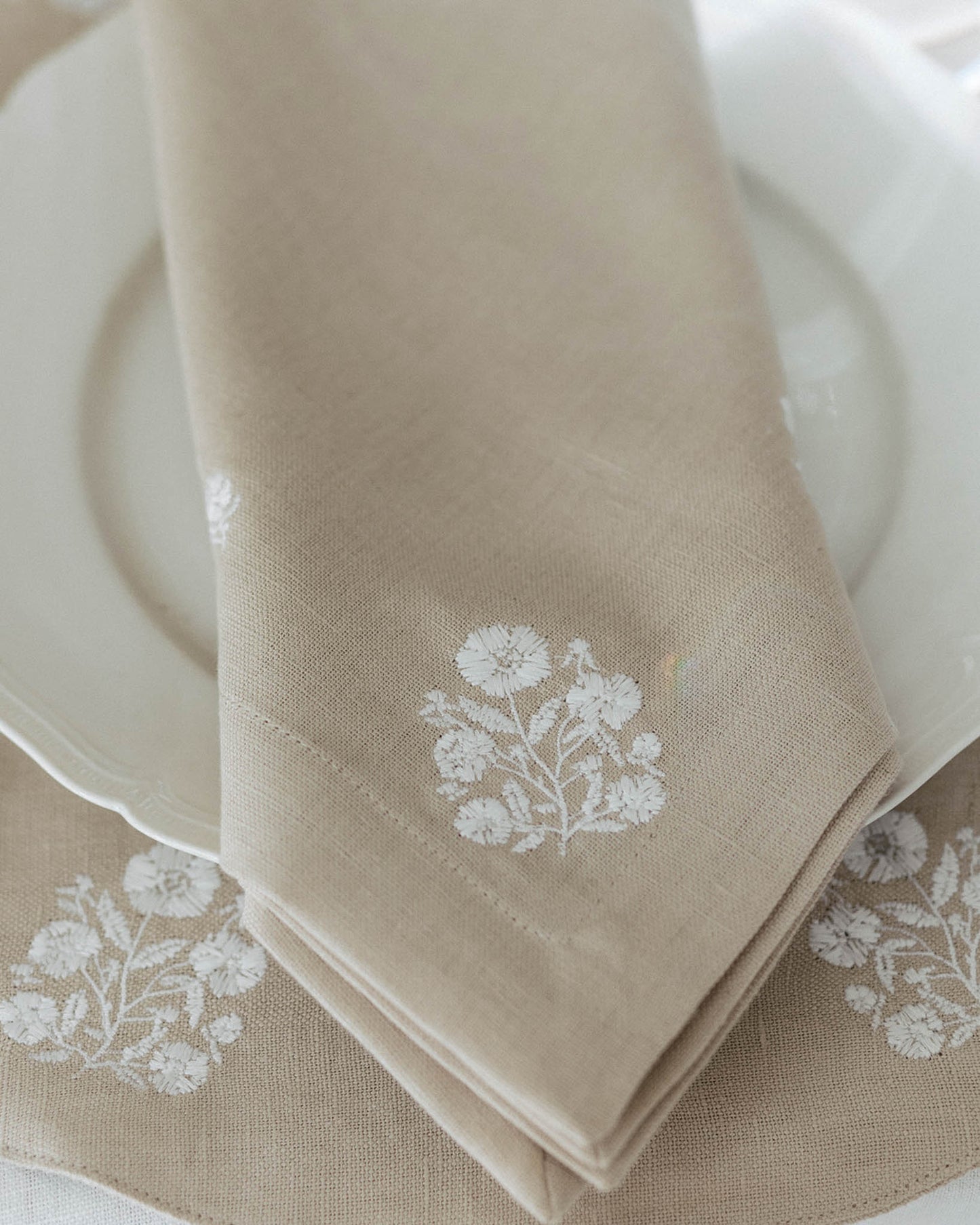 Organic cotton and linen napkins with embroidered floral design, set of four.