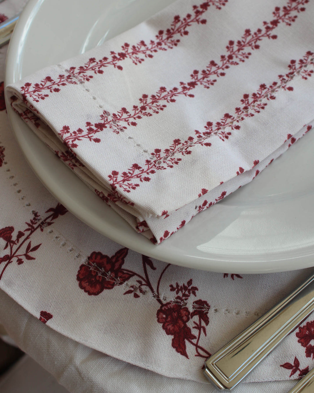 Floral cotton napkins with hemstitch detail, perfect for everyday use and thoughtful hosting.