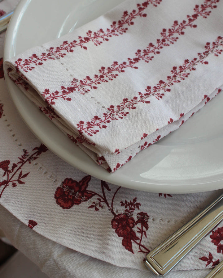 Floral cotton napkins with hemstitch detail, perfect for everyday use and thoughtful hosting.