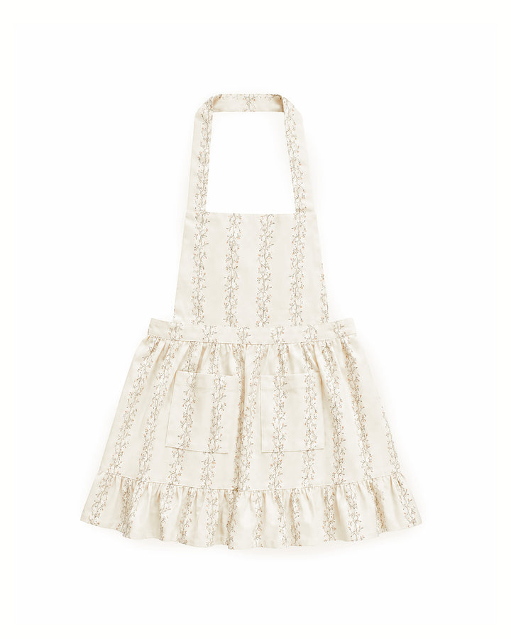 Little girls’ floral apron with ruffle trim, adjustable waist ties, and front pockets, perfect for baking, cooking, crafting, and imaginative play.