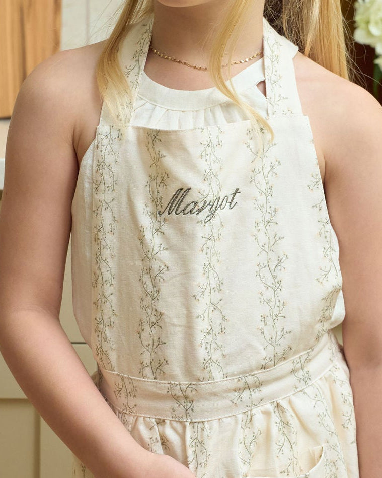 Custom monogram kids baking apron in a classic botanical print, perfect for personalized Christmas gifts, mommy-and-me kitchen sets, holiday cookie parties, and seasonal family traditions.