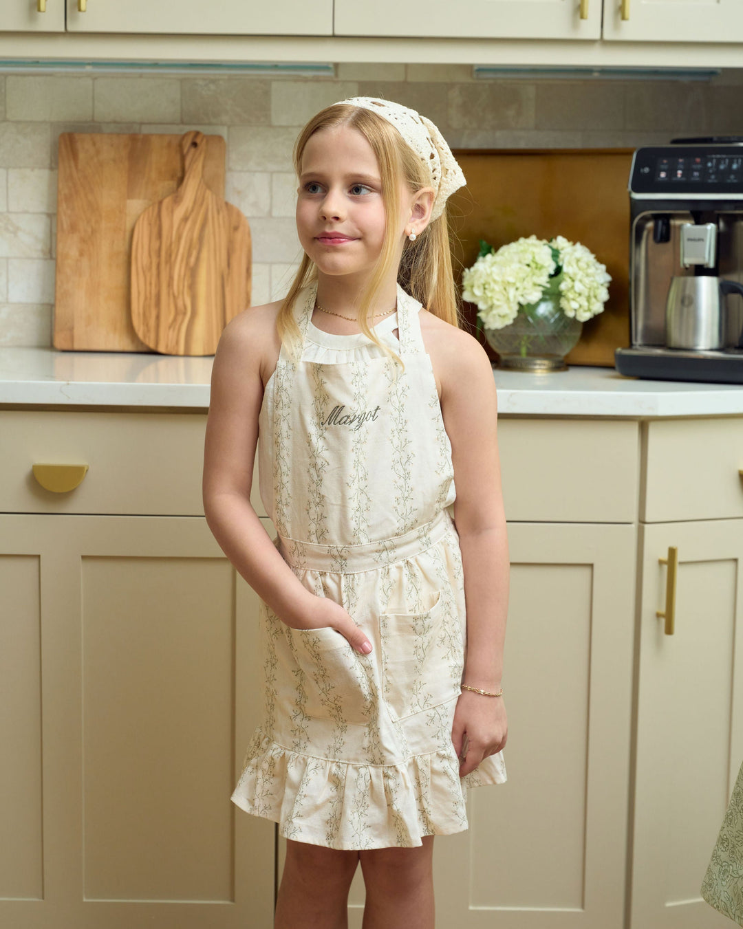 Monogrammed kids Christmas apron in a timeless floral print, designed for matching mommy-and-me holiday baking, gingerbread decorating, winter crafts, and thoughtful personalized gifts.