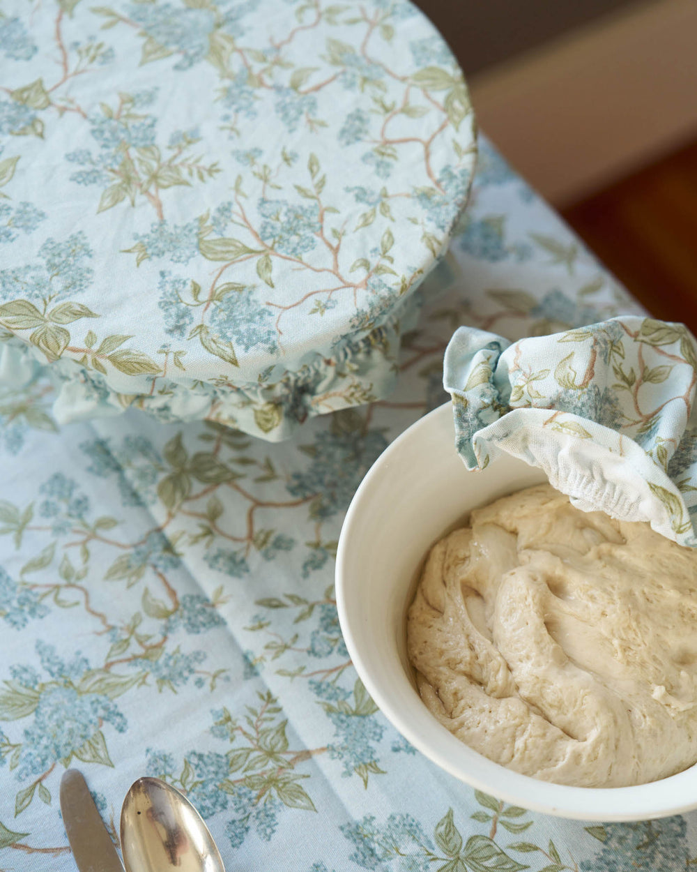 Reusable cotton bowl covers with elastic edge, ideal for covering sourdough and everyday food storage.