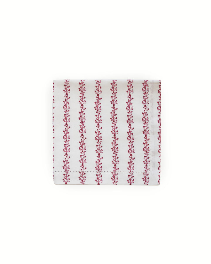 Embrace a French country aesthetic with these red stripe and floral print cotton napkins in a set of 4. Featuring intricate hand-drawn botanical illustrations layered over a subtle stripe pattern, these 20x20 inch napkins complement a coastal grand millennial decor style. Use them for holiday brunch or a rehearsal dinner to create an eye-catching wedding table decor theme. They make a delightful housewarming gift or a gift for a chef, baker, or sister who loves hosting with premium cotton.