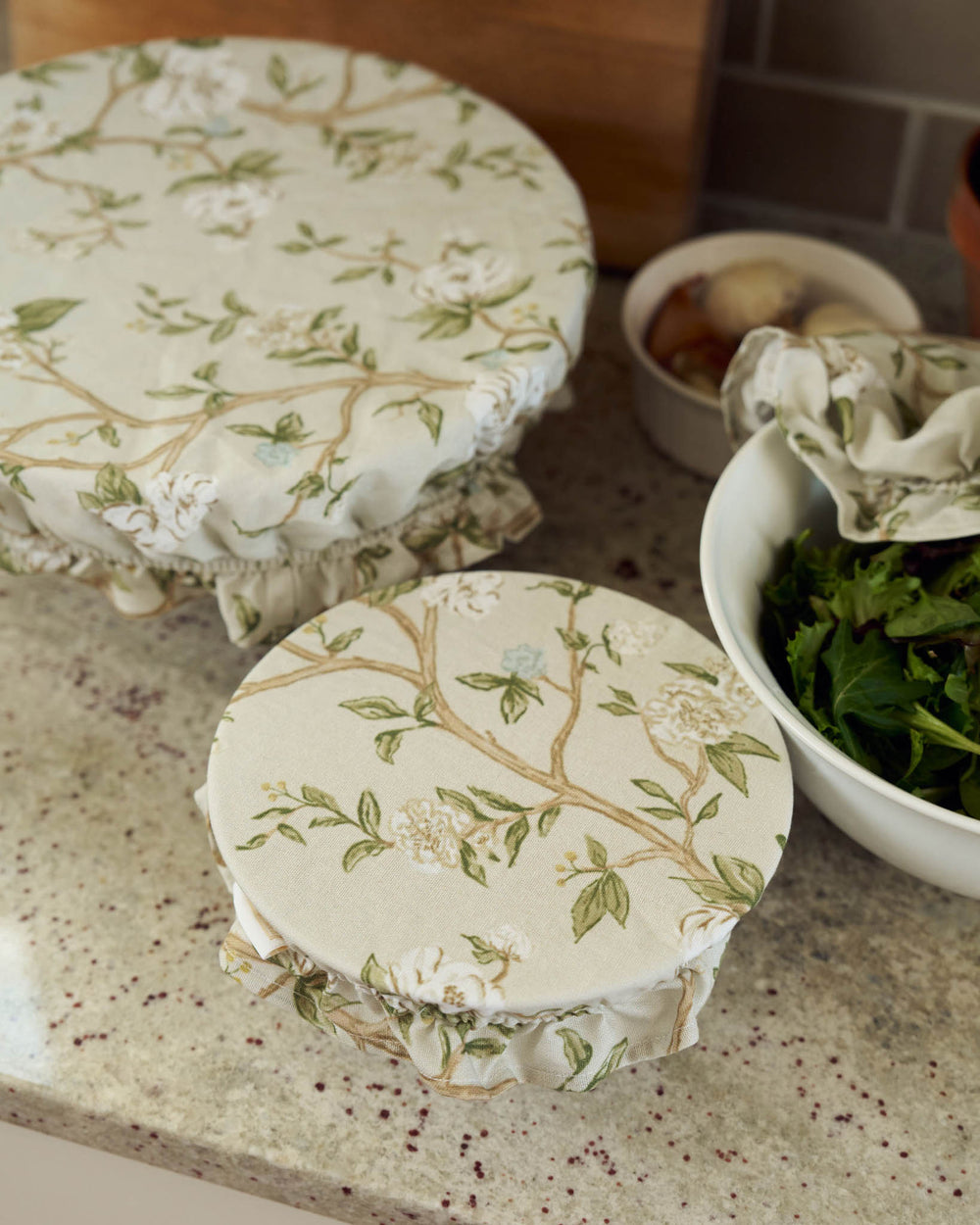 Floral cotton bowl covers for sourdough and storage, combining function and charm in everyday cooking.