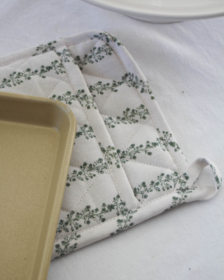 Cotton pot holder set in stripe floral print, perfect for summer hosting and kitchen styling.