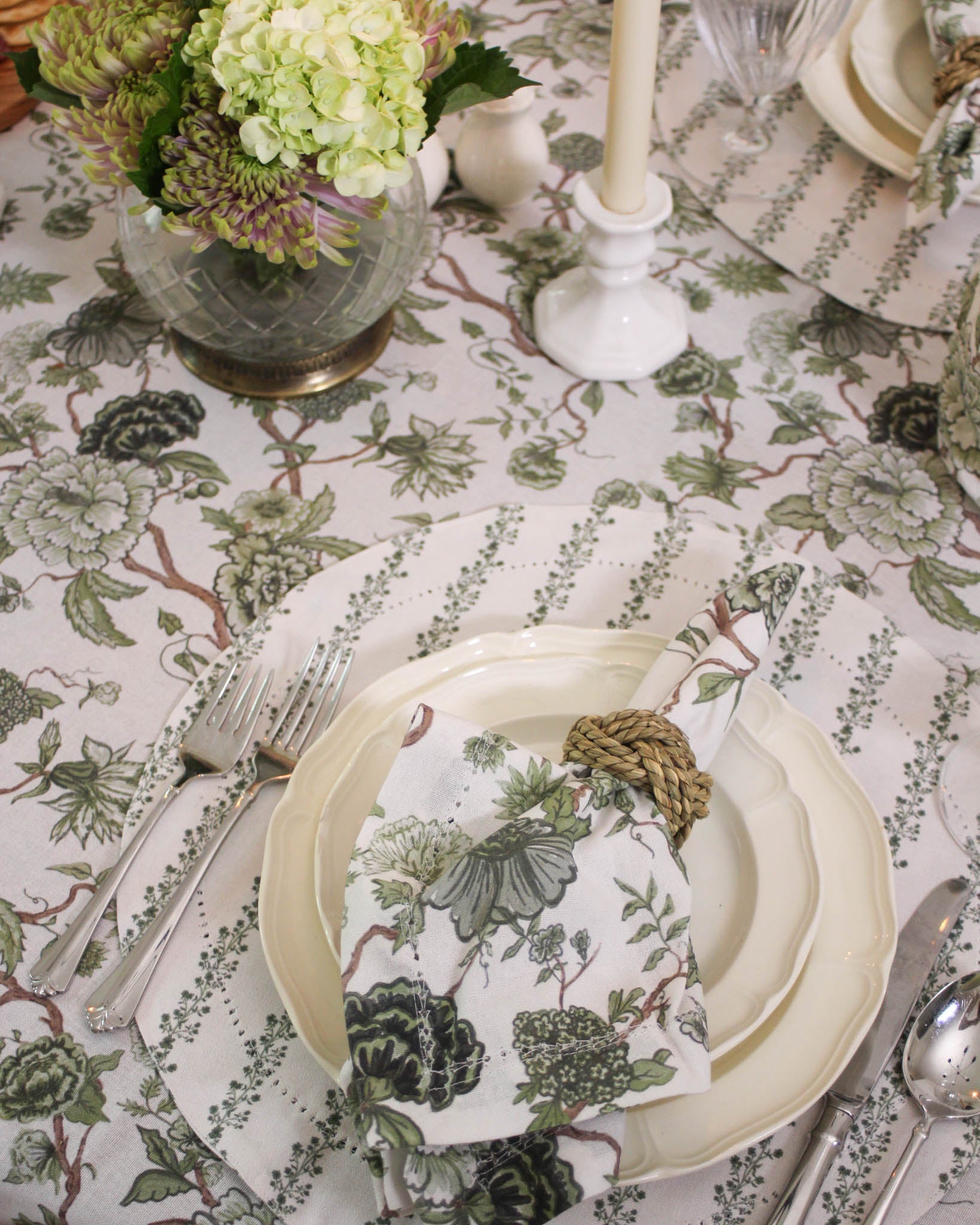 Green floral organic cotton napkins styled on dining table with white plates perfect for thanksgiving and christmas dinner 