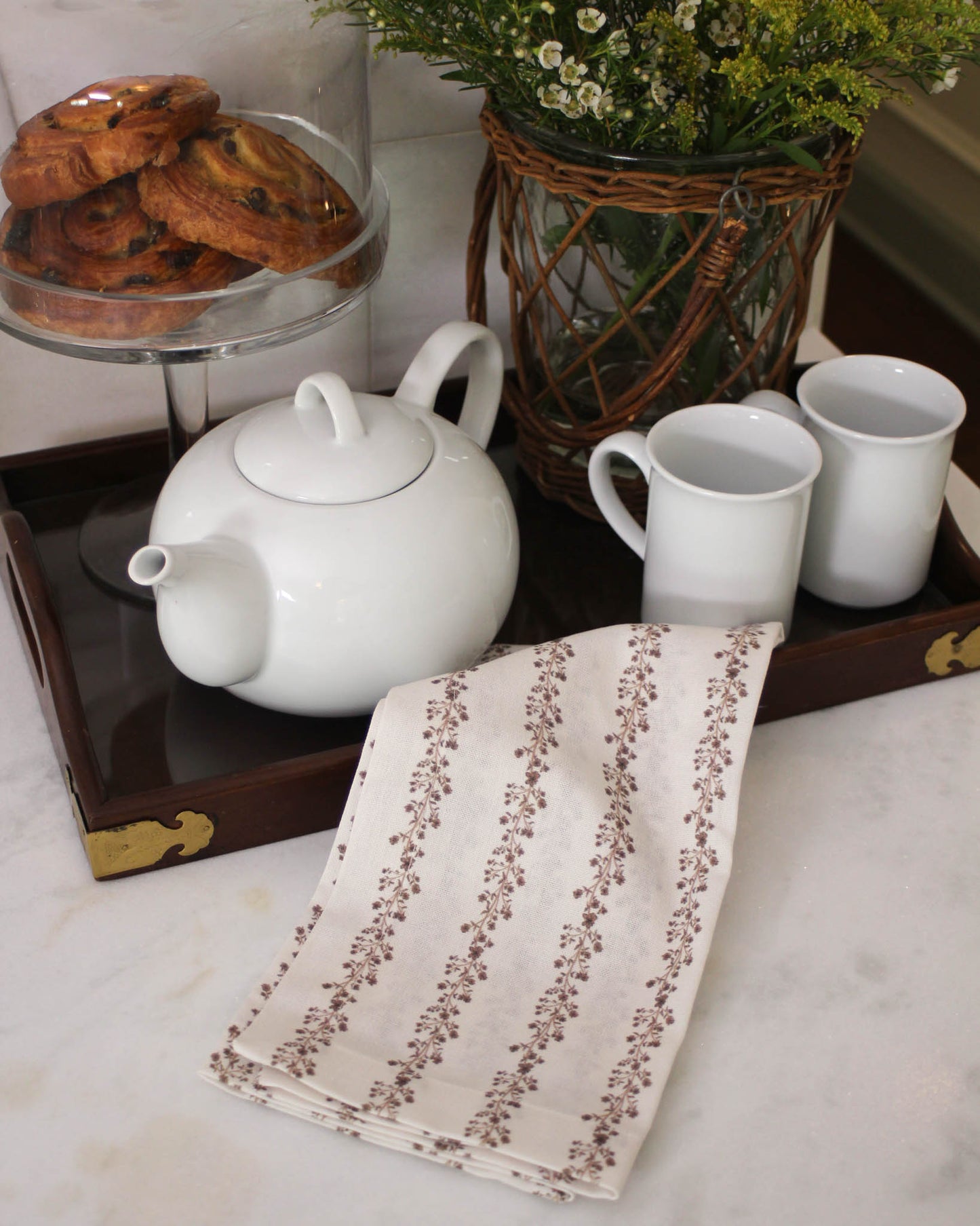 Hand-drawn floral stripe tea towel in organic cotton. Hanging loop, perfect for Thanksgiving & Christmas kitchens. Hostess gift, sustainably made in India.