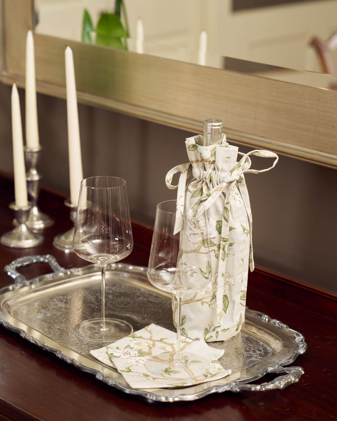 Floral cotton wine gift bag with drawstring closure, perfect for hostess gifts and elegant bottle presentation.